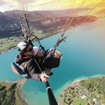 Paragliding flight over lake annecy